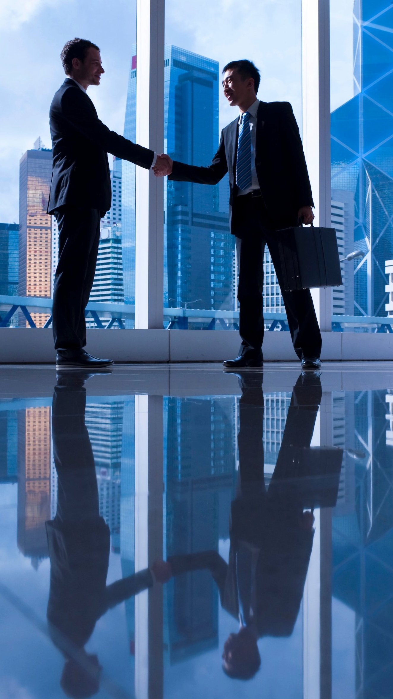 Business partnership discussion in a modern Singapore setting